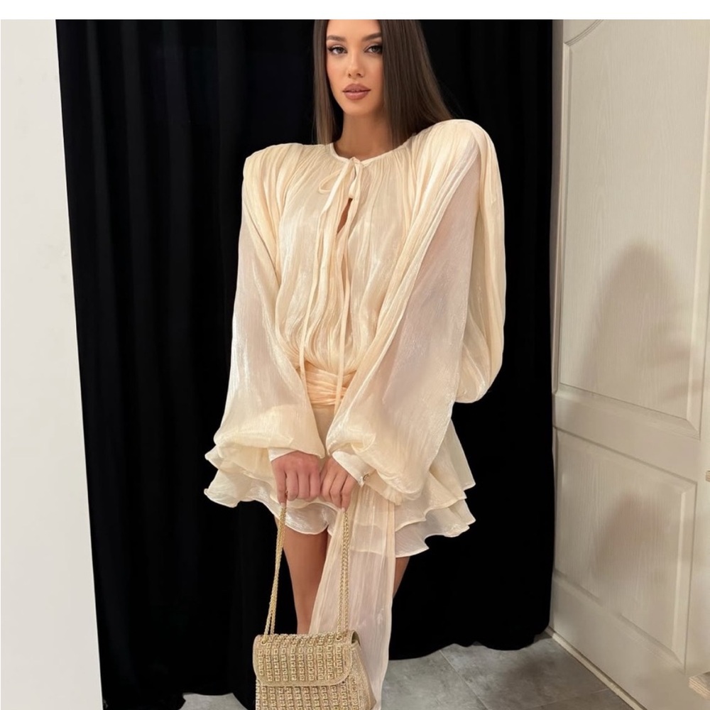 Elegant Cream Dress with Flowing Sleeves